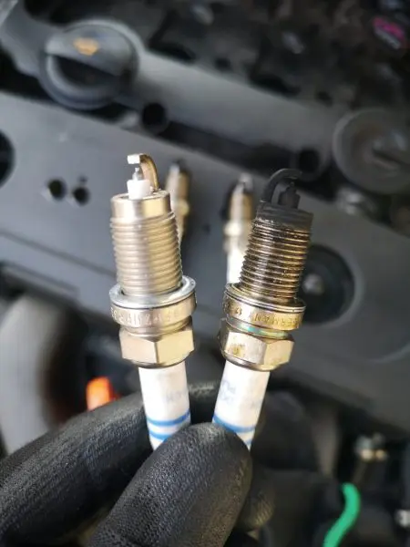 Hands working on engine